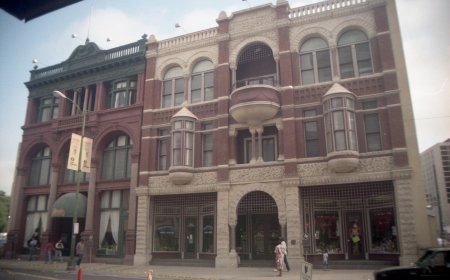 The Stevens Building's (right)  missing elements reconstructed, c. 1983.