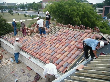 New multi-colored tiles being installed on the roof, 2003.