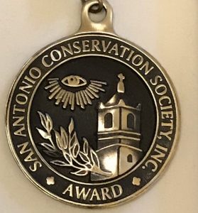 Texas Preservation Hero Award medallion with Society seal