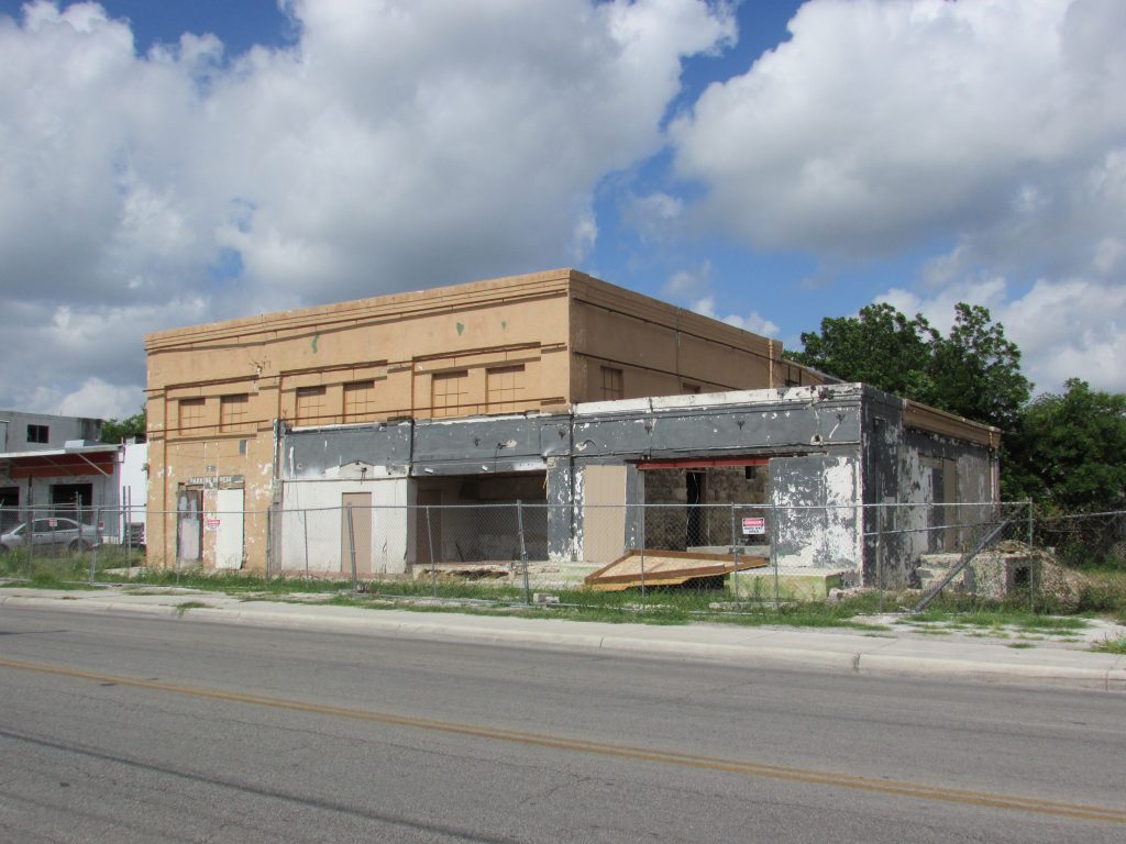 The former Crystal Ice Factory at 1603 S. Hackberry with metal cladding and stone veneer removed to show original 1928 building.