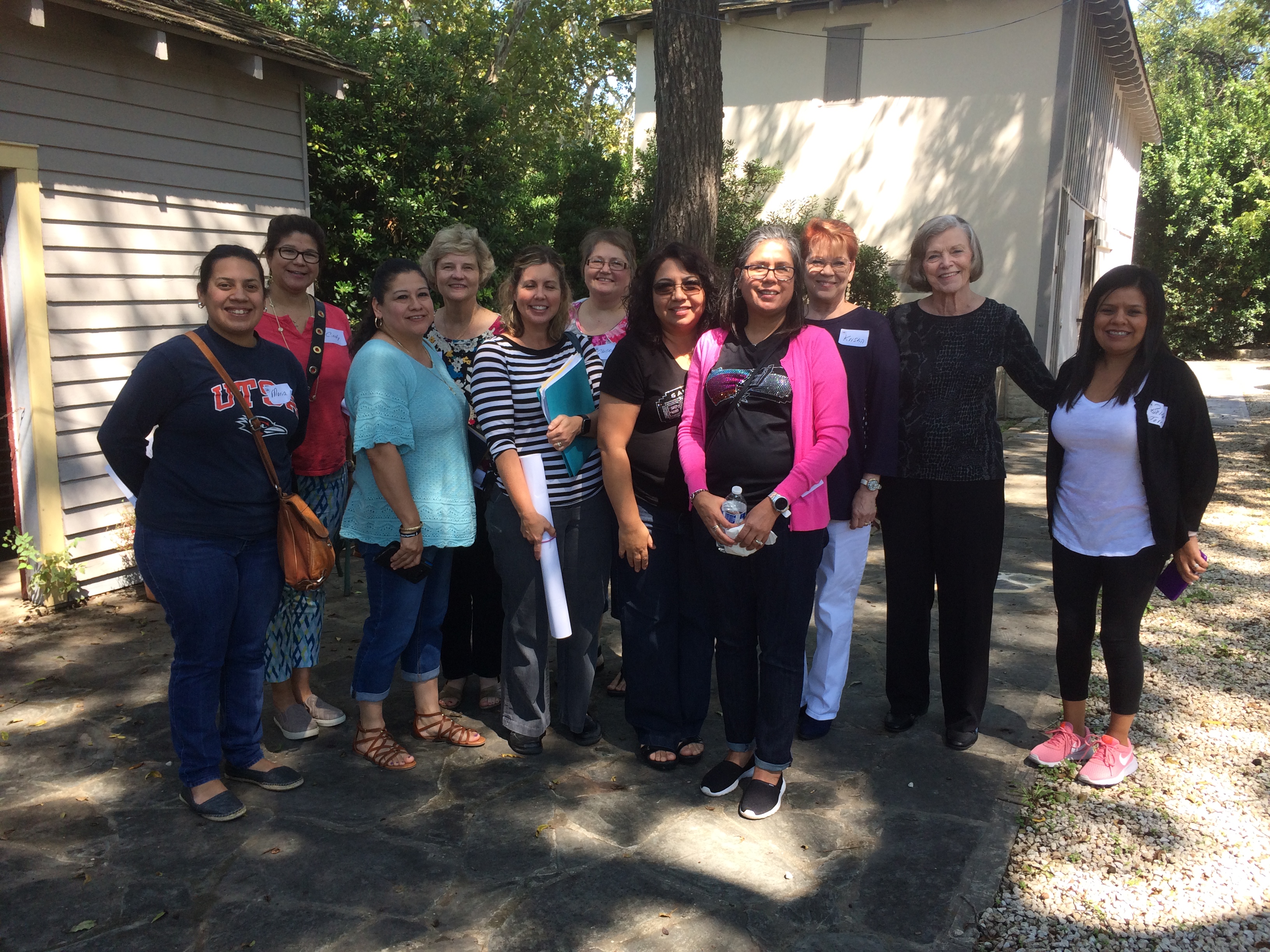 Large group of teachers with Society volunteers outside the RIver House after completion of the Teacher Education Workshop and Seminar