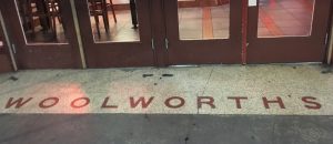 Woolworth's name spelled out on the floor in front of the Houston Street entrance