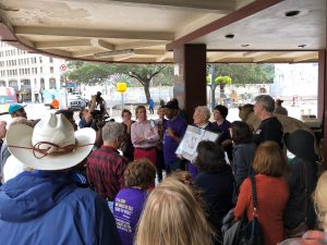 People gathered under Woolworth Building canopy