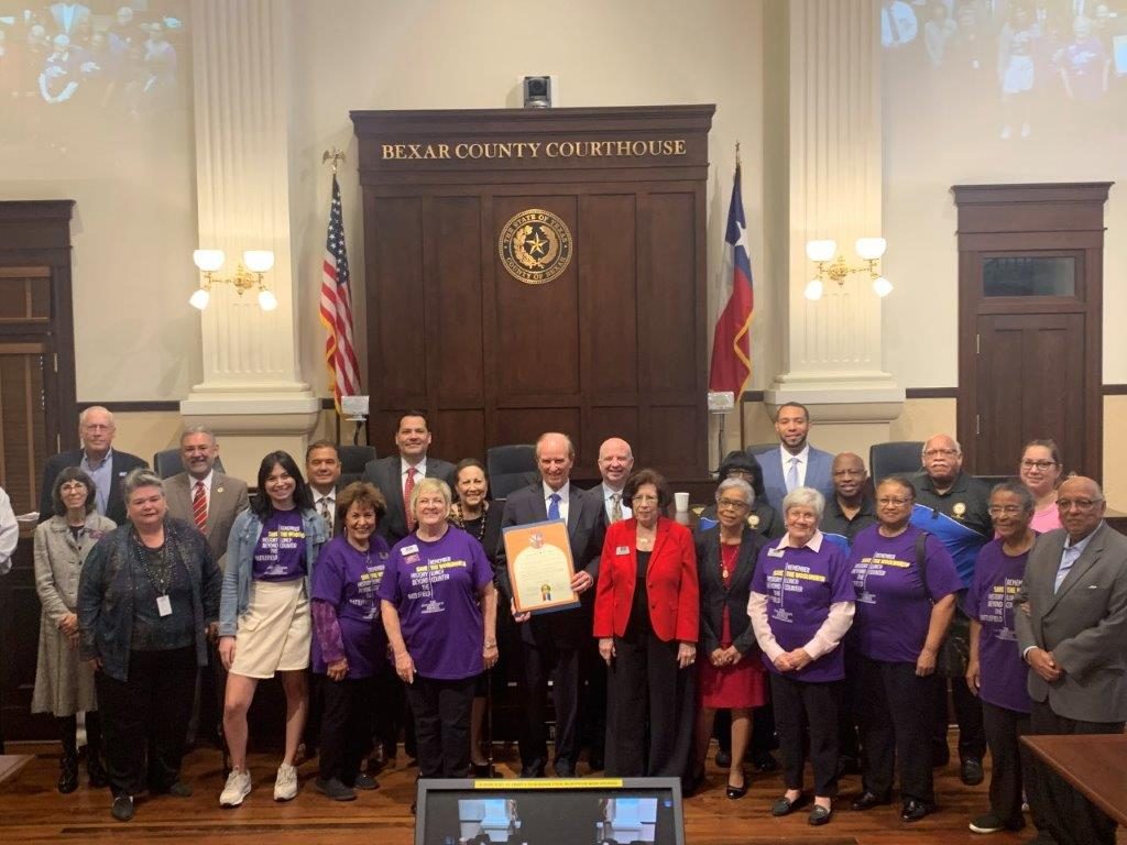 Group portrait of Coalition for the Woolworth Building members with Bexar County Commissioners.