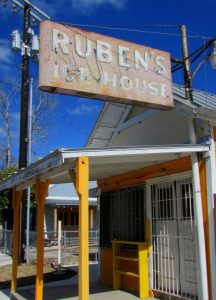 Front of Ruben's Ice House with sign at the corner of S. Colorado and El Paso Streets.