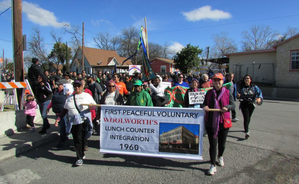 Coalition for the Woolworth Building marching behind banner.