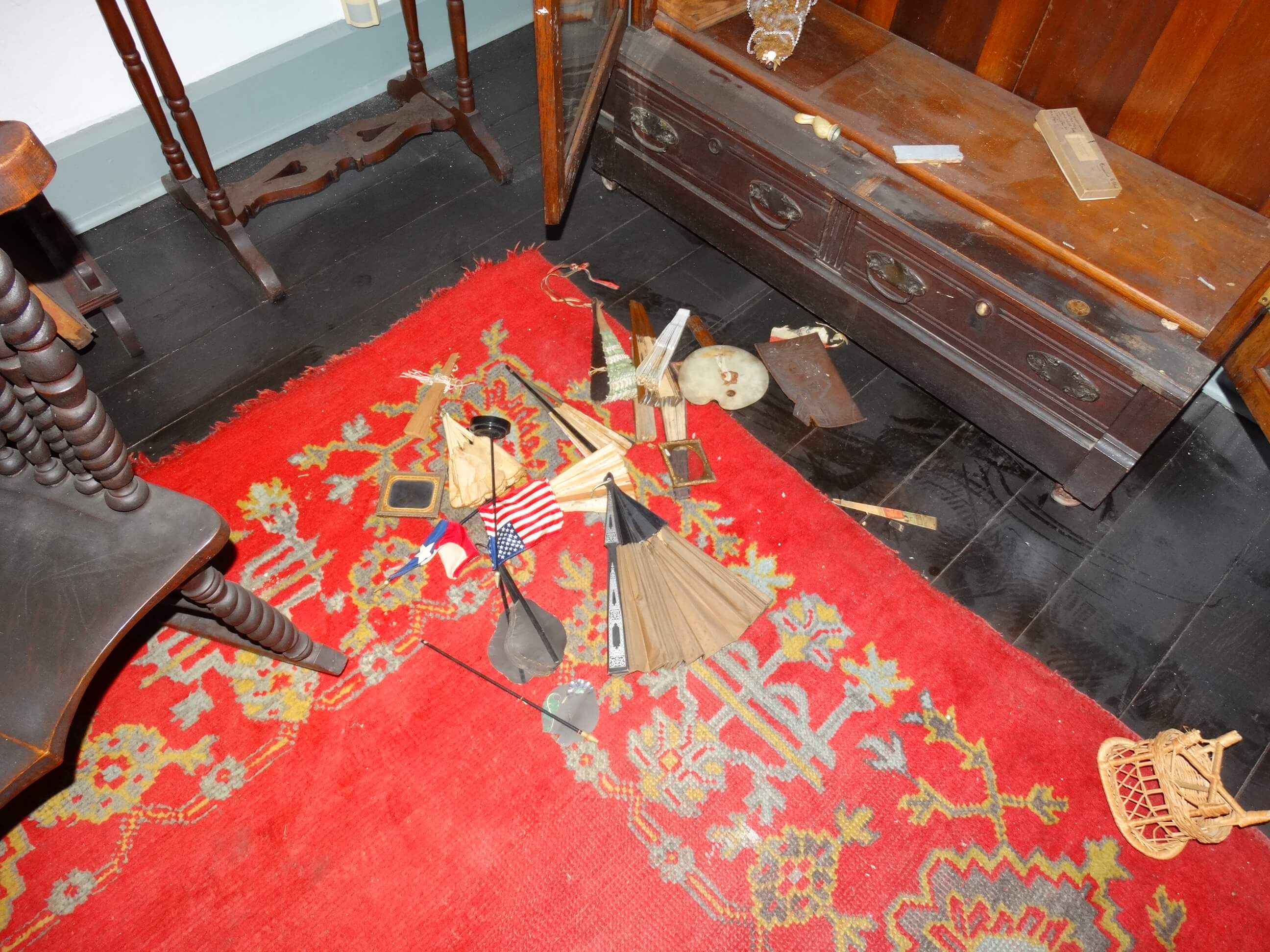 Objects thrown on the dusty floor of the music room by vandals