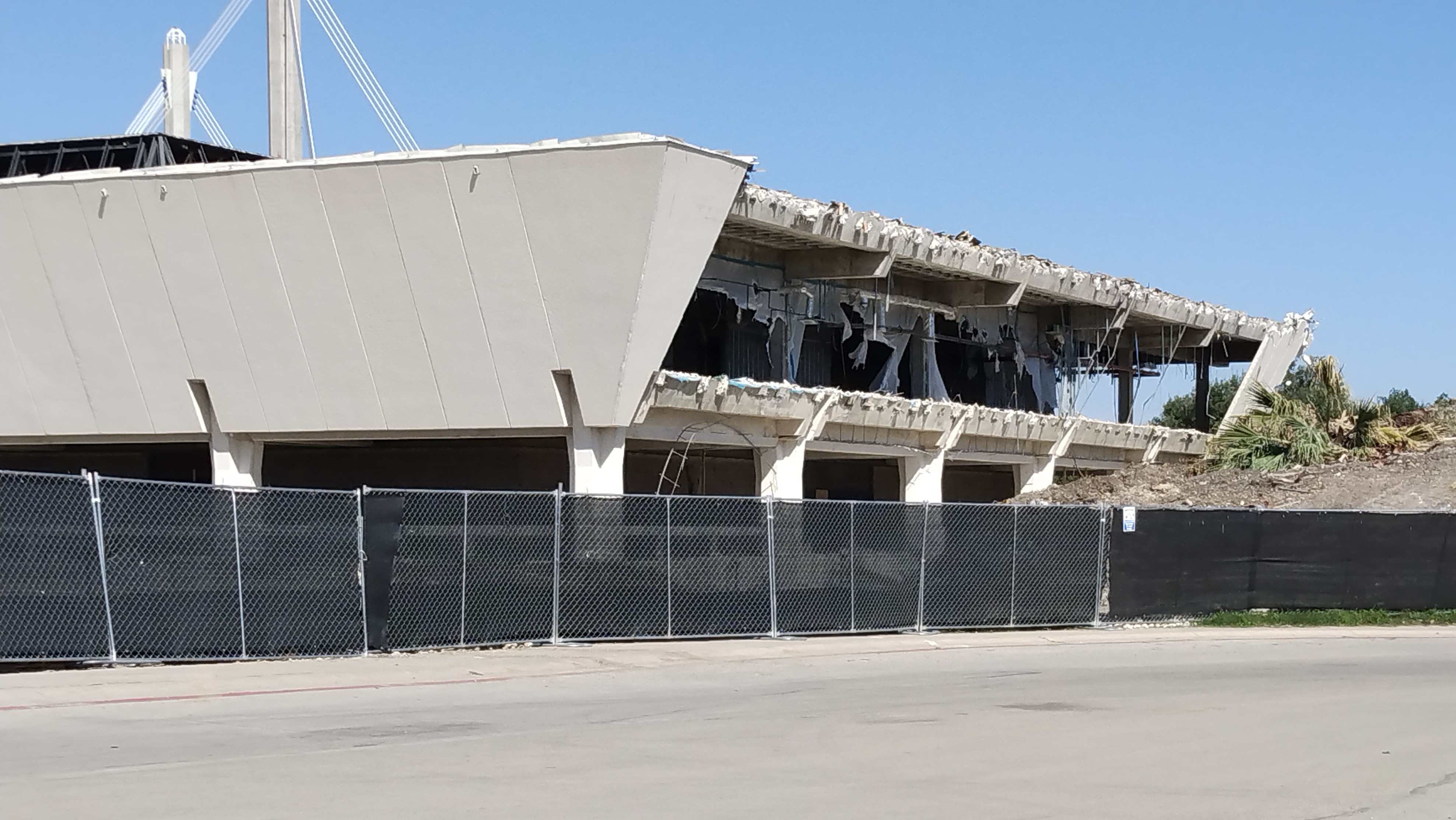 South facade of Institute of Texan Cultures Building ripped open, facing Cesar Chavez Blvd.